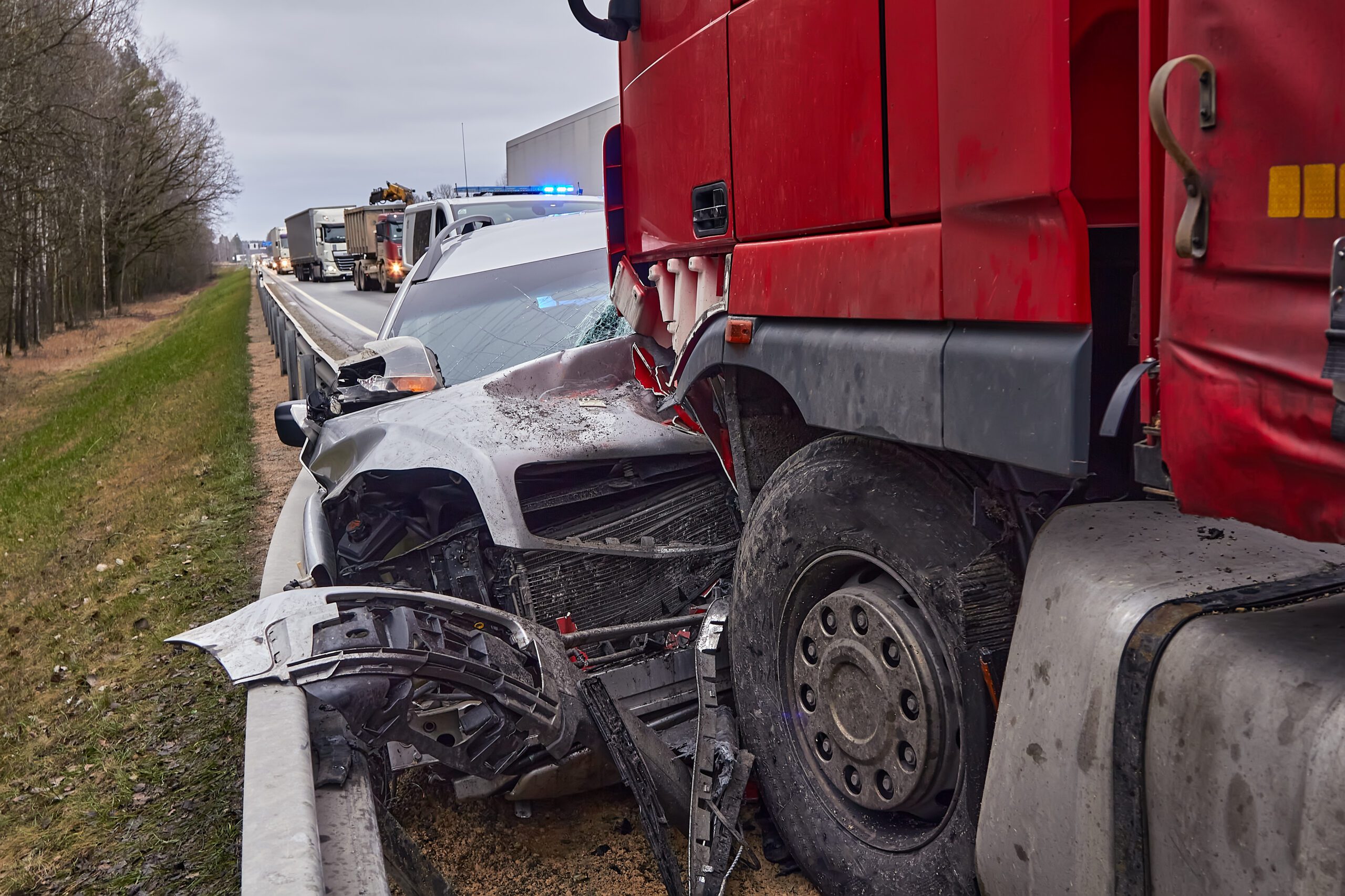 Car after a collision with a heavy truck 18 wheeler crash big rig wreck car wreck lawyer best car wreck lawyer scaled
