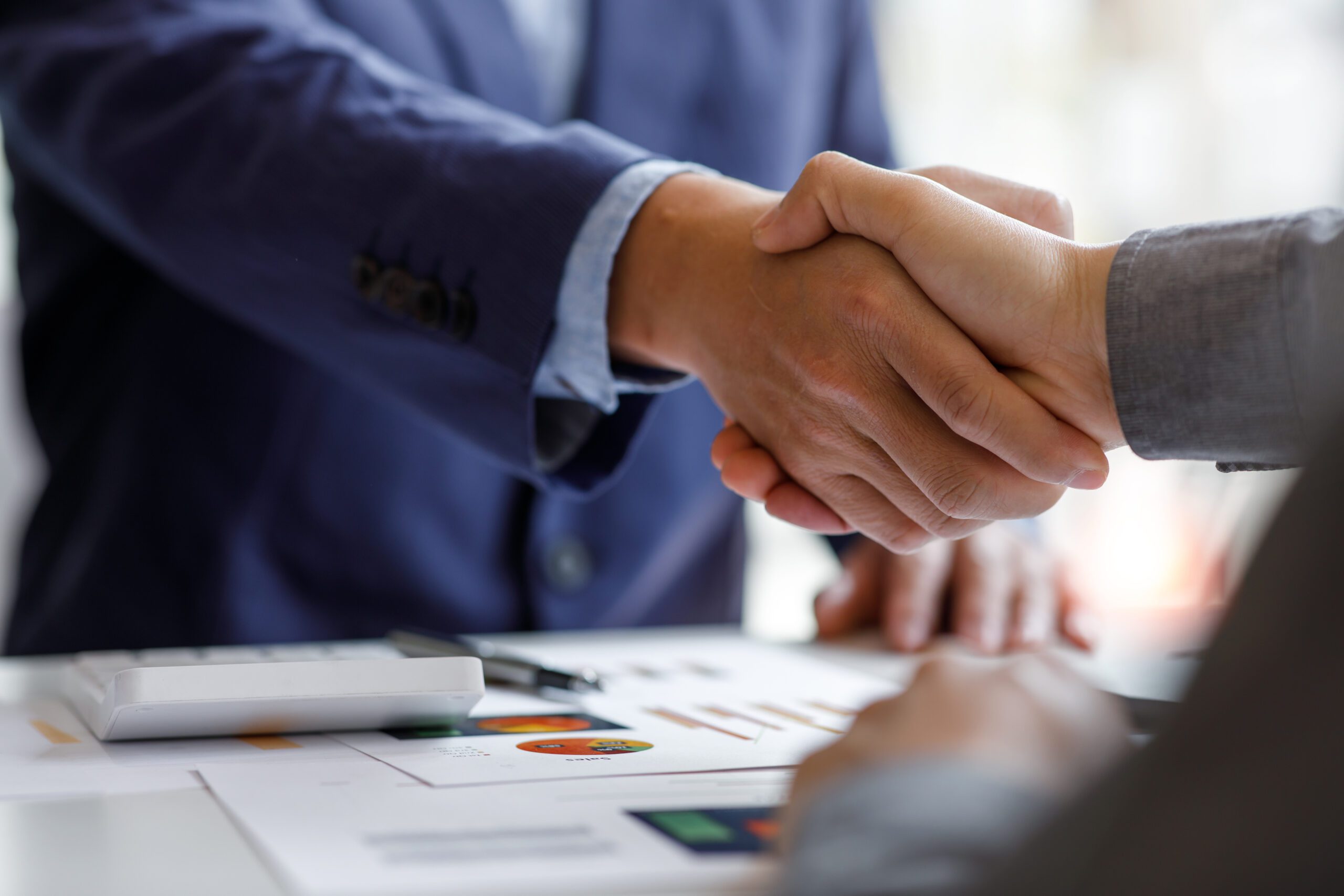 Financial Business handshake for teamwork of business merger and negotiate